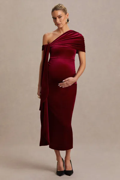 Club L London Zena | Burgundy Velvet Asymmetric-Neck Maternity Midi Dress With Knot And Sash Detail