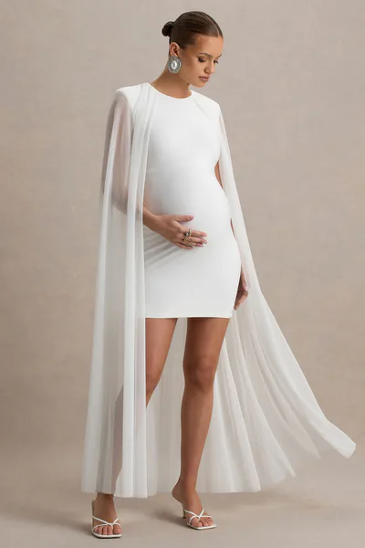 Club L London Charlene | White High-Neck Maternity Mini Dress With Mesh Cape