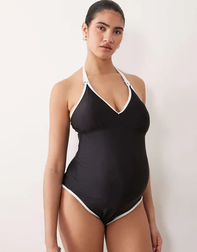 ASOS Mamalicious Maternity contrast binding halter one-piece swimsuit with nursing clip function in black