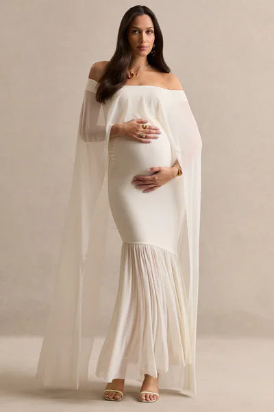 Club L London Bluma | Cream Bardot-Neck Maternity Maxi Dress With Sheer Skirt And Cape Detail