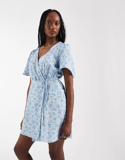 ASOS Vero Moda Tall flutter sleeve wrap front mini dress in blue floral print