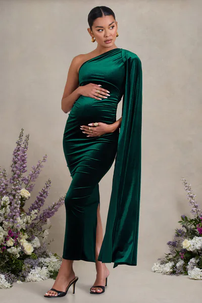 Club L London Amaryllis | Bottle Green Velvet Maternity One Shoulder Maxi Dress with Cape Sleeve